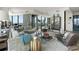 A wide angle view of the living room featuring a comfortable grey sofa, large windows and tasteful decor at 3344 Peachtree Ne Rd # 3601, Atlanta, GA 30326