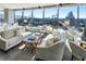 Elegant living room boasting floor-to-ceiling windows, comfortable seating, and panoramic city views at 3344 Peachtree Ne Rd # 3601, Atlanta, GA 30326