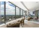 Stylish living room featuring floor-to-ceiling windows with city views, elegant decor, and hardwood floors at 3344 Peachtree Ne Rd # 3601, Atlanta, GA 30326