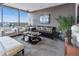 Elegant living room with large windows, comfortable seating, and a sophisticated decor, offering city views at 3344 Peachtree Ne Rd # 3601, Atlanta, GA 30326