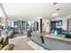 Expansive living room with sleek furniture, city view windows, and adjacent dining and kitchen areas at 3344 Peachtree Ne Rd # 3601, Atlanta, GA 30326