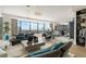 Open-concept living area showcasing city views, modern lighting, comfortable sofas, and chic decor at 3344 Peachtree Ne Rd # 3601, Atlanta, GA 30326