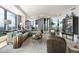 Large living room with city views, comfortable seating, modern decor, and an open-concept design at 3344 Peachtree Ne Rd # 3601, Atlanta, GA 30326