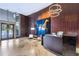 Modern lobby featuring a reception desk, unique art, and elegant tile flooring and wood paneling at 3344 Peachtree Ne Rd # 3601, Atlanta, GA 30326