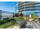 Outdoor community pool area equipped with stainless steel gas grill and well-maintained landscaping at 3344 Peachtree Ne Rd # 3601, Atlanta, GA 30326