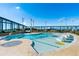 Rooftop community pool area with sleek lounge furniture, greenery, and city views at 3344 Peachtree Ne Rd # 3601, Atlanta, GA 30326