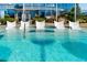 A unique pool with in-water tanning chairs and a relaxing, resort-like atmosphere with a blue sky backdrop at 3344 Peachtree Ne Rd # 3601, Atlanta, GA 30326