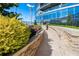 Landscaped walkway with a stone retaining wall leading to the community amenities in the building at 3344 Peachtree Ne Rd # 3601, Atlanta, GA 30326