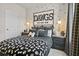 Cozy bedroom features playful dog-themed accents, stylish decor, and black and white color scheme at 409 Nix Ln, Lawrenceville, GA 30046
