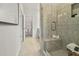 Elegant tiled shower with a glass door and a built-in bench at 409 Nix Ln, Lawrenceville, GA 30046