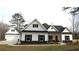 Charming new construction home with black and white color scheme and three-car garage at 879 Highway 101 N, Dallas, GA 30157