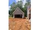 The open garage awaits your custom touches in this new construction home at 879 Highway 101 N, Dallas, GA 30157