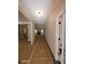 The main hallway that connects the entrance to the living room, kitchen, and other parts of the home at 879 Highway 101 N, Dallas, GA 30157