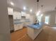 Beautiful kitchen showcasing granite countertops, white cabinets, and a functional center island at 879 Highway 101 N, Dallas, GA 30157