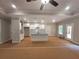 Spacious kitchen featuring an island with modern countertops, stylish lighting, and white cabinetry at 879 Highway 101 N, Dallas, GA 30157