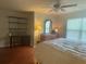 Comfortable bedroom with ceiling fan, desk, and large window at 487 Cypher Dr, Suwanee, GA 30024
