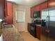 Efficient kitchen featuring granite countertops, stainless steel appliances, and ample cabinet space at 487 Cypher Dr, Suwanee, GA 30024