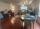 Inviting living room with hardwood floors, a cozy seating area, and ample natural light at 487 Cypher Dr, Suwanee, GA 30024