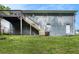 Spacious backyard with a deck and staircase that provide access to the home at 535 Transit Cir, Atlanta, GA 30349