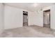 Unfinished basement featuring concrete floors, exposed pipes, and doorway at 535 Transit Cir, Atlanta, GA 30349