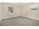 Bright bedroom with neutral carpet and natural light from the window at 535 Transit Cir, Atlanta, GA 30349
