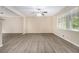 Spacious living room with large window and modern plank flooring at 535 Transit Cir, Atlanta, GA 30349