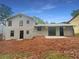 Exterior back of house with sliding glass door at 1950 Matthew Way, Lithonia, GA 30058