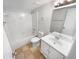 Well-lit bathroom with white fixtures, vanity, and tub-shower, offering essential amenities at 1950 Matthew Way, Lithonia, GA 30058