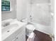 Bathroom with tiled shower and single sink vanity at 1950 Matthew Way, Lithonia, GA 30058