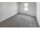 This bedroom has new carpet and a large window for natural light at 1950 Matthew Way, Lithonia, GA 30058