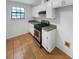 Efficient kitchen features stainless steel appliances, white cabinets, and a gas range at 1950 Matthew Way, Lithonia, GA 30058
