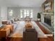 Bright living room with a stone fireplace, large bay window, and hardwood floors at 1950 Matthew Way, Lithonia, GA 30058