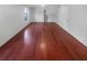 Bright living room with hardwood floors, window and adjacent staircase at 1950 Matthew Way, Lithonia, GA 30058