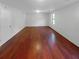 Spacious living room features sleek hardwood floors and a bright, neutral color palette at 1950 Matthew Way, Lithonia, GA 30058