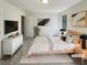 Staged main bedroom featuring neutral walls, modern decor, and plush bedding at 1950 Matthew Way, Lithonia, GA 30058