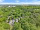 Aerial view of a property nestled in dense trees in a residential area at 2244 Spink Nw St, Atlanta, GA 30318