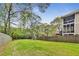 Expansive fenced backyard with lush green grass and play equipment at 2244 Spink Nw St, Atlanta, GA 30318