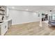 Finished basement featuring a wet bar, laminate wood floor, and open layout great for entertaining at 2244 Spink Nw St, Atlanta, GA 30318