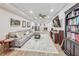 Relaxing finished basement with sectional seating, TV, and stylish decor creating an inviting space at 2244 Spink Nw St, Atlanta, GA 30318