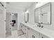 Bright bathroom featuring a double vanity, modern fixtures, and an open shower-tub at 2244 Spink Nw St, Atlanta, GA 30318
