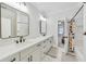 Bright bathroom featuring a double vanity, modern fixtures, and an open shower-tub at 2244 Spink Nw St, Atlanta, GA 30318