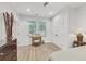 Bedroom showcasing a desk, white doors, and natural light from a window at 2244 Spink Nw St, Atlanta, GA 30318