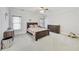 Neutral bedroom featuring carpet, a ceiling fan, and a lovely wood bed and dresser at 2244 Spink Nw St, Atlanta, GA 30318