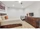 Cozy bedroom with comfortable bed, dresser, TV, and a cozy sitting area at 2244 Spink Nw St, Atlanta, GA 30318