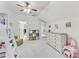 Charming bedroom featuring a ceiling fan, neutral carpet, and a playful pink vanity set at 2244 Spink Nw St, Atlanta, GA 30318