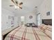 Light-filled bedroom with wood-look flooring, a ceiling fan, and access to an en-suite bathroom at 2244 Spink Nw St, Atlanta, GA 30318