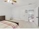 Bright bedroom with carpet, a ceiling fan, and neutral paint at 2244 Spink Nw St, Atlanta, GA 30318