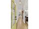 Inviting foyer with hardwood floors, bright walls, a yellow front door, and access to a bathroom and staircase at 2244 Spink Nw St, Atlanta, GA 30318
