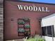 The Woodall restaurant exterior showcasing its brick facade and decorative greenery at 2244 Spink Nw St, Atlanta, GA 30318