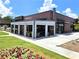 The Woodall restaurant boasts a modern exterior with outdoor seating and professional landscaping at 2244 Spink Nw St, Atlanta, GA 30318